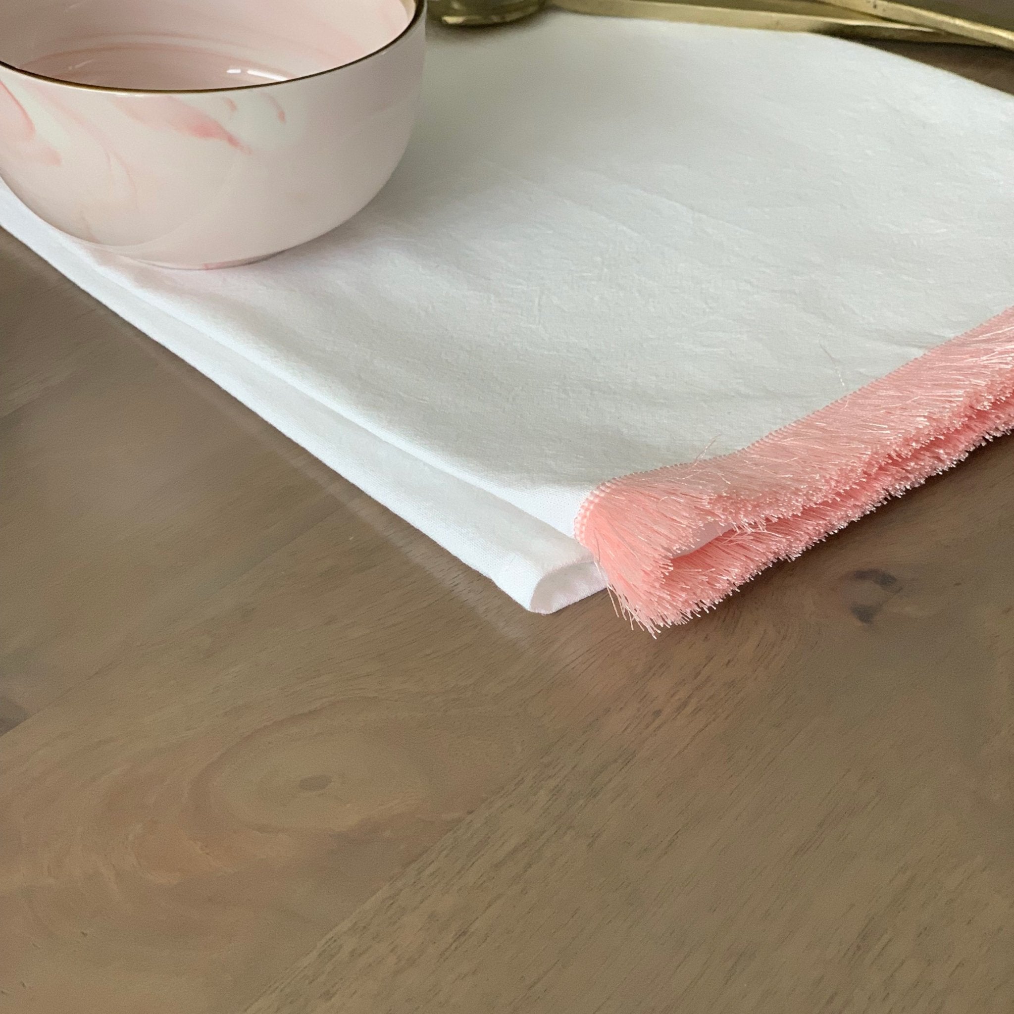 http://www.teaandlinen.com/cdn/shop/products/pink-fringe-tea-towel-692810.jpg?v=1618843210